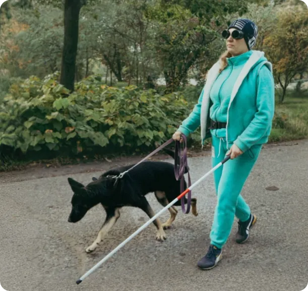 Practising mobility with a dog and a white cane.